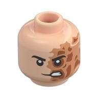 Minifig Head Two-Face, Black Eyebrows, Nougat/Dark Orange Burned Left Side, Lopsided Scowl