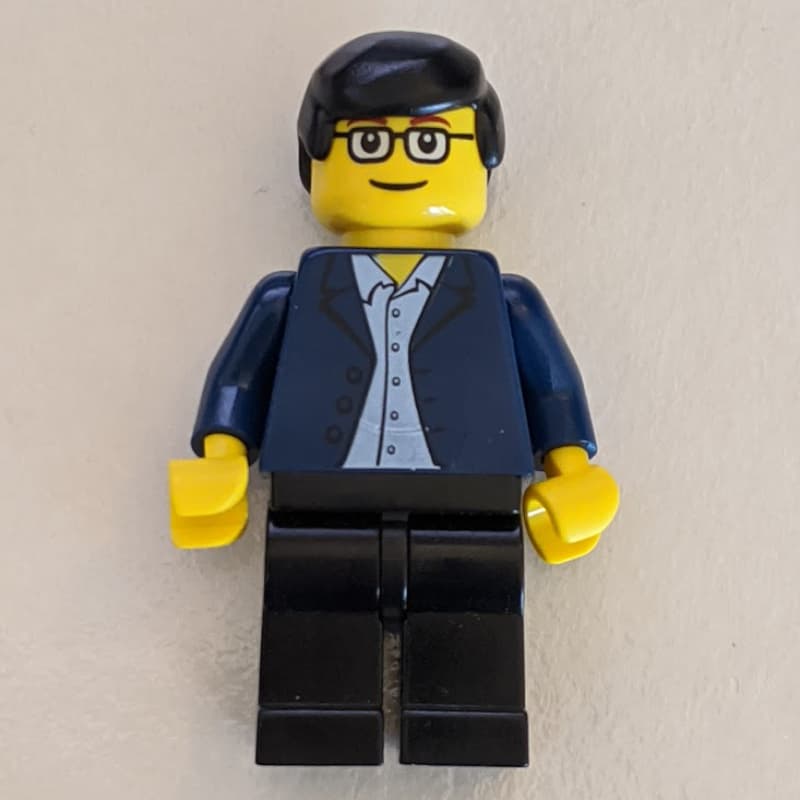 Man - Dark Blue Jacket, Black Legs, Glasses