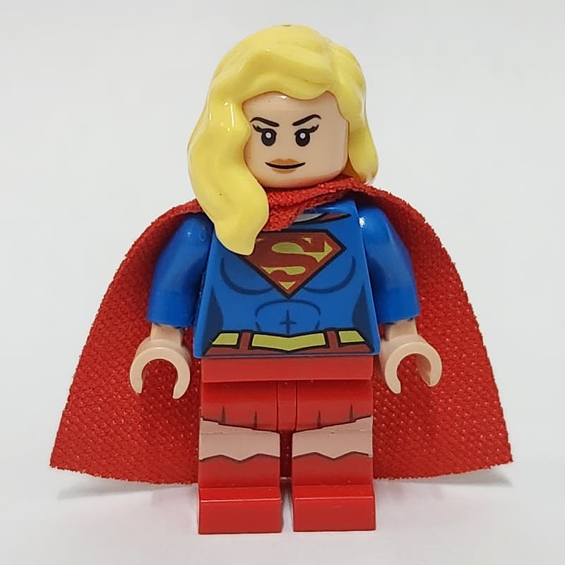 Supergirl with Bright Light Yellow Hair over Shoulder