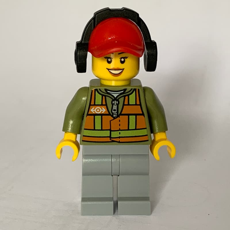 Train Worker, Woman, Orange Safety Vest with Train Logo over Olive Green Hoodie, Light Bluish Gray Legs, Red Cap with Ear Defenders